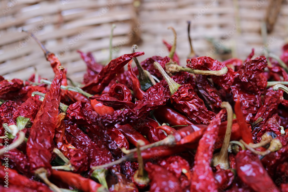 Closeup Pile of air-dried red chili peppers background. Hot and spicy dry red chillies. Closeup Pile of air-dried red chili peppers background. Hot and spicy dry red chillies.