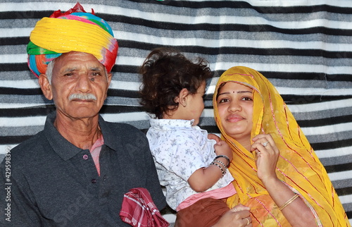 Portrait photo with grandfather, grandson and daughter-in-law of Indian origin