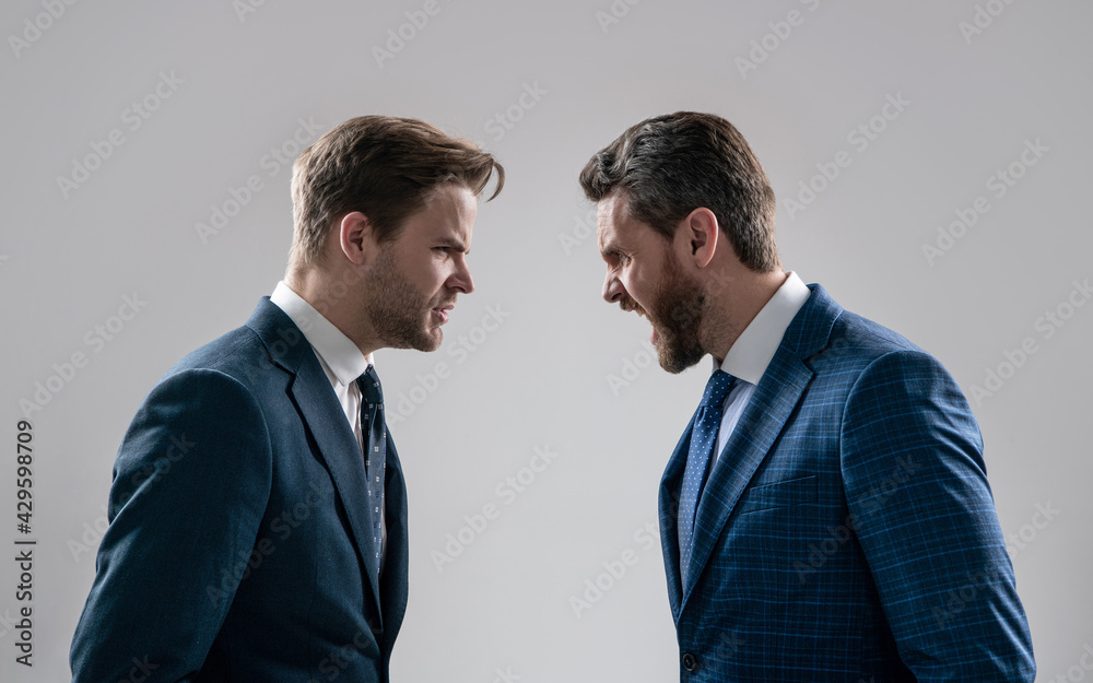 two angry businessmen shouting face to face have business competition, contradiction. two angry businessmen shouting face to face have business competition, contradiction.