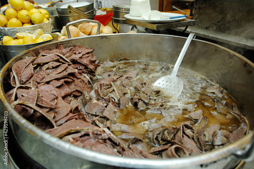 Bread with spleen called pane ca meusa is a tyical street food of Palermo city in Sicily