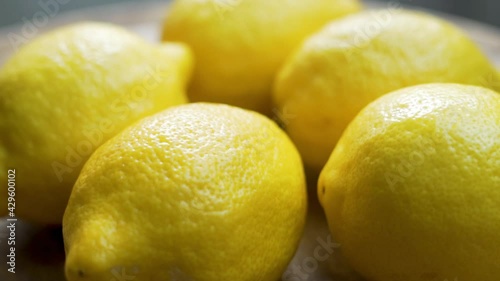 Yellow Fresh Whole Citrus Fruit Lemons, Close-up, Isolated. Rotation Of Ripe Lemonons. Lemon background. Healthy Vegan Food and a Vegetarian Diet. photo