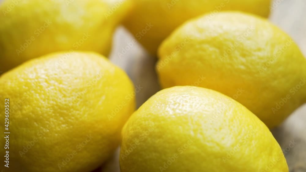 Rotation Of Fresh Whole Lemons, Citrus Fruits, Close-up. Background of Juicy Lemons. Yellow Lemons Are Isolated. Healthy and Vitamin-rich Vegetarian Food and Diet. Rotation Of Fresh Whole Lemons, Citrus Fruits, Close-up. Background of Juicy Lemons. Yellow Lemons Are Isolated. Healthy and Vitamin-rich Vegetarian Food and Diet.