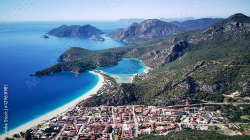 Amazing beautiful panoramic view from drone of natural park of Oludeniz and Fethiye blue lagoon and tranquil aquamarine dead sea.
