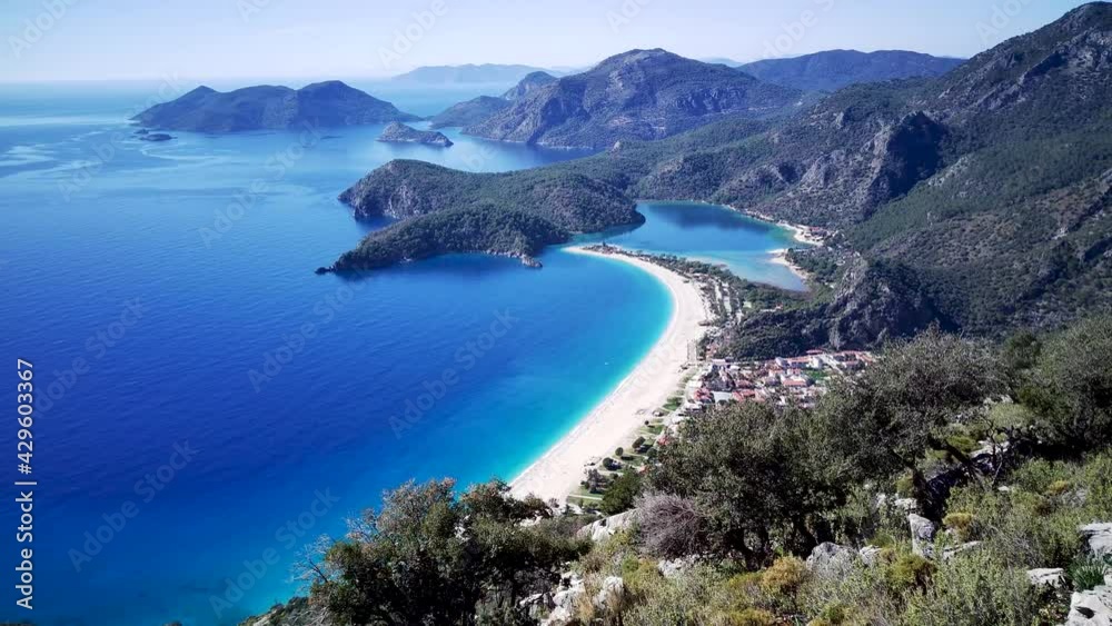 Amazing beautiful panoramic view from drone of natural park of Oludeniz and Fethiye blue lagoon and tranquil aquamarine dead sea.
Amazing beautiful panoramic view from drone of natural park of Oludeniz and Fethiye blue lagoon and tranquil aquamarine dead sea.