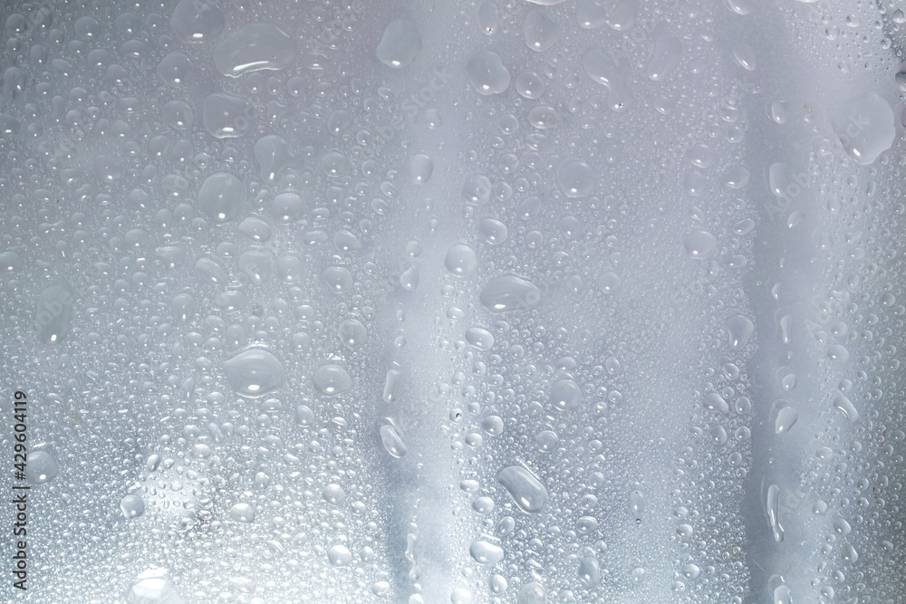 Water droplets and raindrops on clear glass Water droplets and raindrops on clear glass