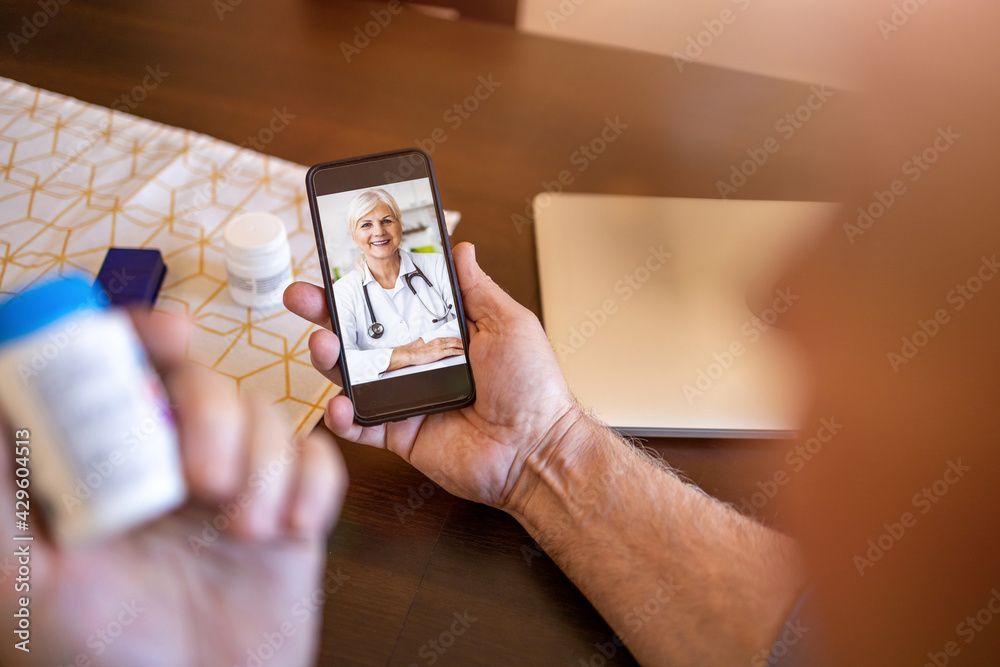 Senior woman consulting with a doctor on her phone

