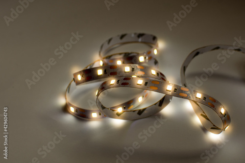 Wallpaper Mural Led strip tape lightiong isolated in dark background. Diode as a component for home made lighting. Diy and save energy concept. Torontodigital.ca