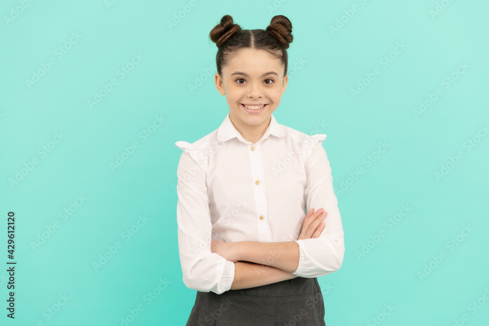 Confident teenage girl pupil happy smile keeping arms crossed blue background, confidence Confident teenage girl pupil happy smile keeping arms crossed blue background, confidence
