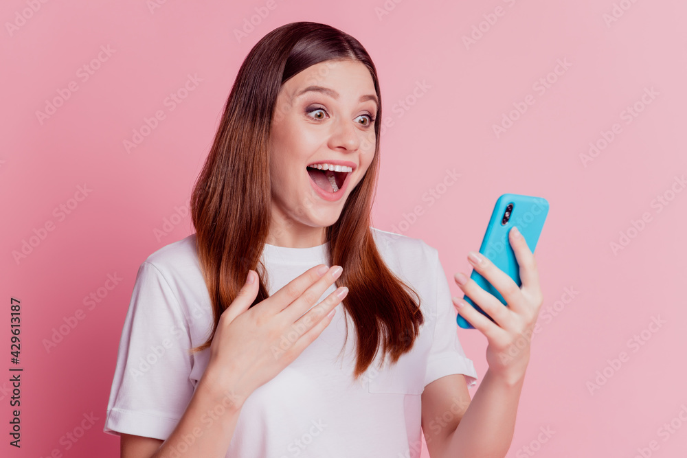 Photo of crazy girl use cellphone hand chest open mouth look screan read post Photo of crazy girl use cellphone hand chest open mouth look screan read post