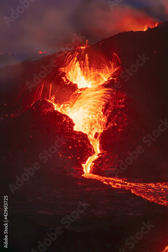 Photography Lava erupting from the volcanic crater in Iceland, longer exposure