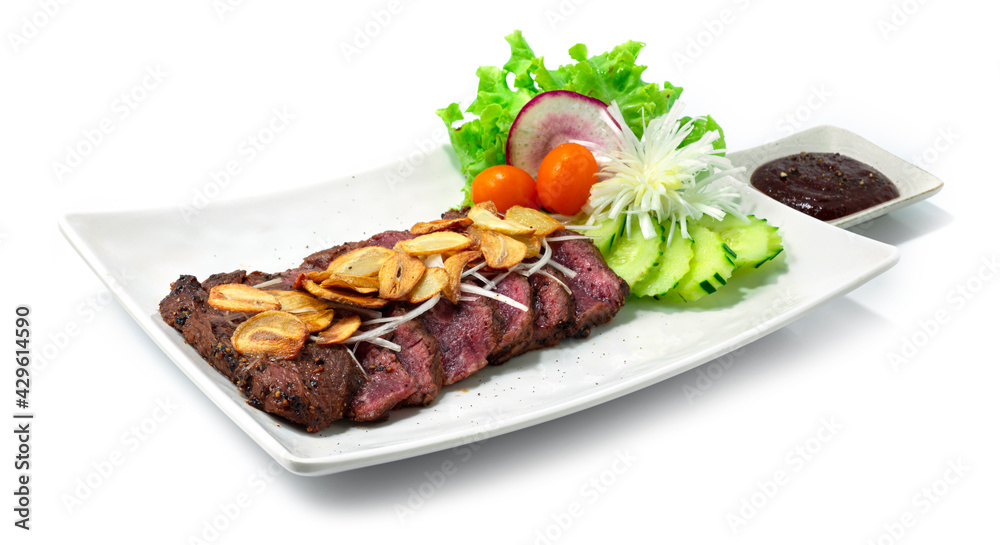 Beef Steak Medium Rare ontop Crispy Garlic served BBQ Black Peppers Sauce Beef Steak Medium Rare ontop Crispy Garlic served BBQ Black Peppers Sauce