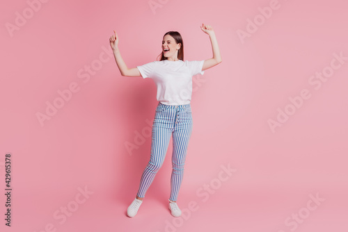 Portrait of a happy young woman dancing have fun dreamy mood
