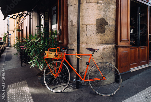 Cozy street with old bicycle in Paris, France. Architecture and landmarks of Paris. Postcard of Paris