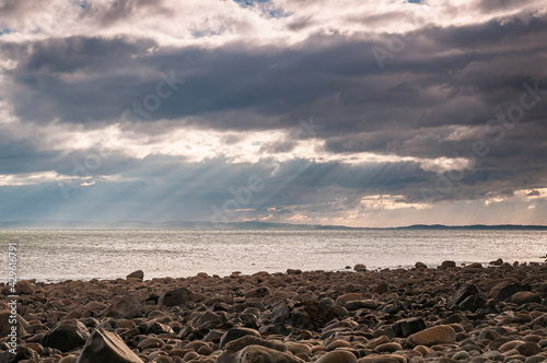 A cloudy, 3 shot autumnal HDR image of evening light across Luce Bay, Dumfries and Galloway, Scotland. photo