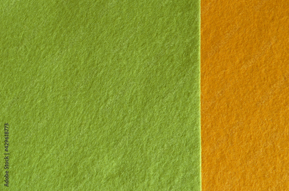 Fototapeta premium Yellow and green felt fabric texture for background.