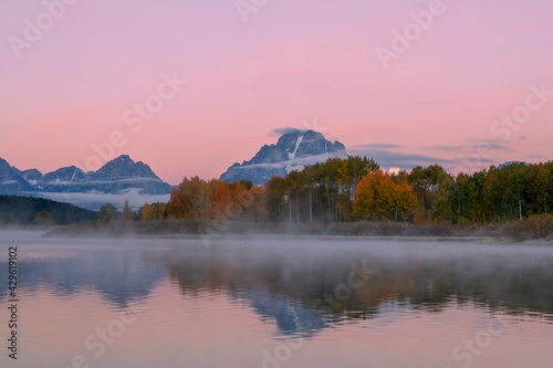 Scenic Reflection Landscape of the Moon Setting in the Tetons in Autumn