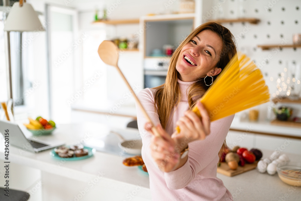 Beautiful woman having fun in kitchen at home Beautiful woman having fun in kitchen at home