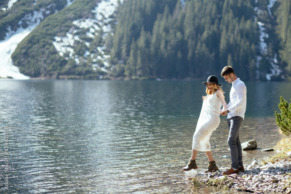 Young couple has a love story in the mountains. Young couple has a love story in the mountains.