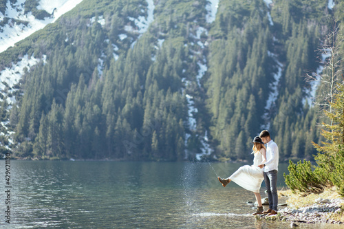 Young couple has a love story in the mountains.