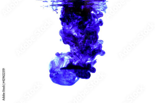 Fototapeta Naklejka Na Ścianę i Meble -  The entry of blue color into the liquid. Visible surface from below and color movement