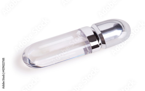 Tube of liquid transparent lipstick gloss with applicator isolated on white background with clipping path