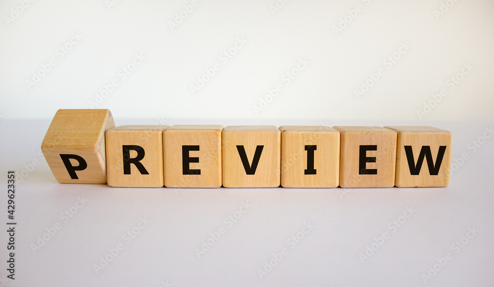 Preview or review symbol. Turned the cube and changed the word 'preview' to 'review'. Beautiful white background, copy space. Business, preview or review concept. Preview or review symbol. Turned the cube and changed the word 'preview' to 'review'. Beautiful white background, copy space. Business, preview or review concept.