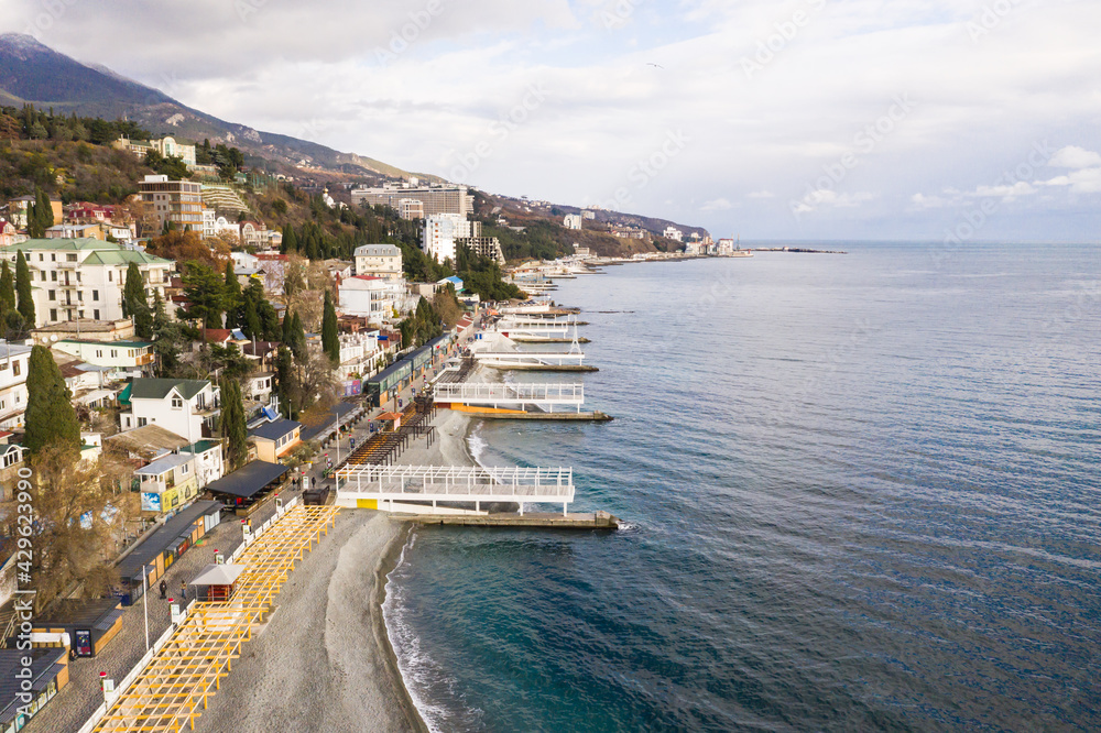 Yalta. Crimea. Winter 2020. Yalta samostroy from the embankment side. Coastal houses of the southern resort. The most well-maintained embankment of Yalta for 2020.