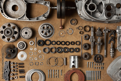 Top view of a complete set of parts for a vintage motorcycle engine
