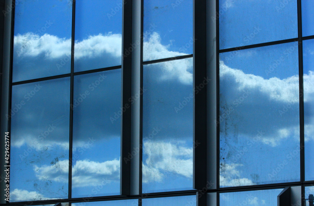 Fototapeta premium reflection of clouds in the window