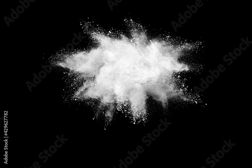 White Powder explosion on black background.