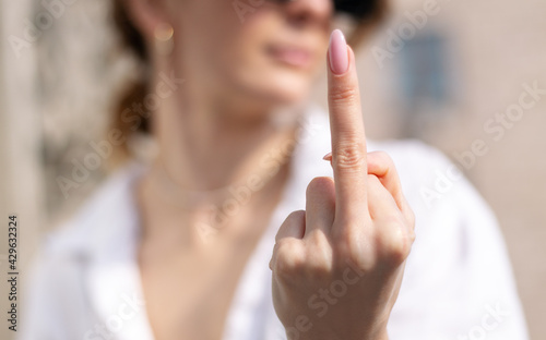 Quadro su tela Offended woman showing middle finger