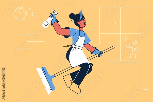 Happy housewife on broom concept