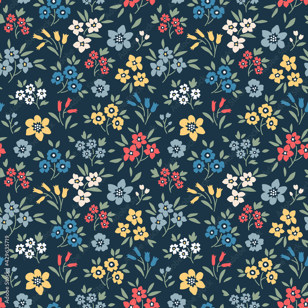 Seamless floral pattern. Ditsy background of small colorful flowers. Small flowers scattered over a navy blue background. Stock vector for printing on surfaces and web design.