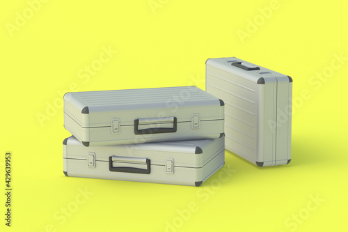 Metal suitcases for money or documents on yellow background. 3d render
