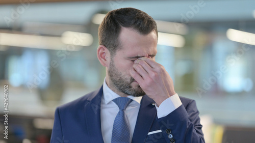 Frustrated Middle Aged Businessman Upset by Conditions, Feeling Tired