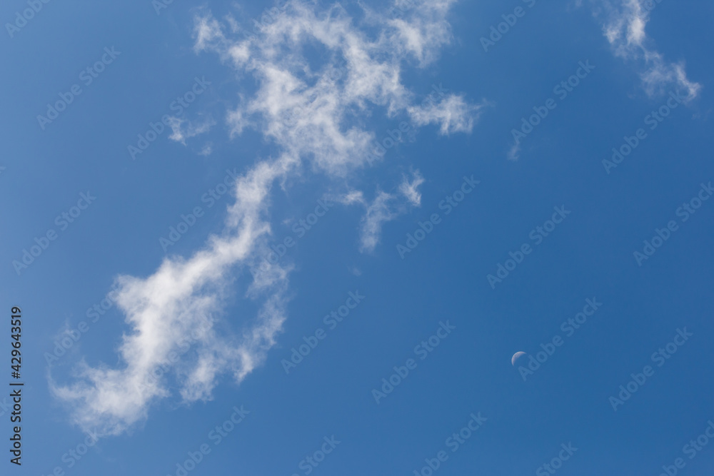 The white crescent moon in the afternoon cool white clouds on beautiful afternoon sky background Images for clear sky background design make you feel fresh and airy. The white crescent moon in the afternoon cool white clouds on beautiful afternoon sky background Images for clear sky background design make you feel fresh and airy.