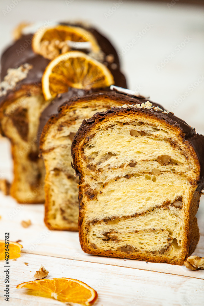 Panettone is the traditional Italian dessert for easter in 2021. Homemade panettone covered in chocolate and sprinkles. Bread served as dessert. Panettone is the traditional Italian dessert for easter in 2021. Homemade panettone covered in chocolate and sprinkles. Bread served as dessert.