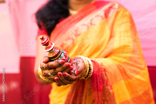 Indian bride with her sindur pot in her hand photo