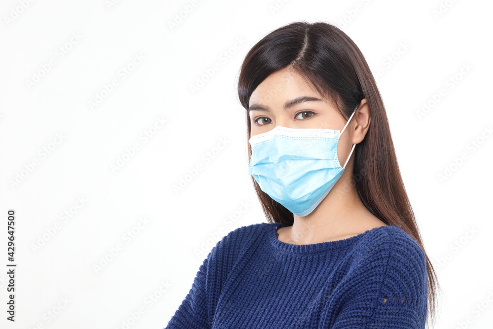 Asian long haired beautiful woman Wear a protective mask against the coronavirus (COVID-19) and flu. White background. The concept of health care to reduce the transmission of infection. Asian long haired beautiful woman Wear a protective mask against the coronavirus (COVID-19) and flu. White background. The concept of health care to reduce the transmission of infection.
