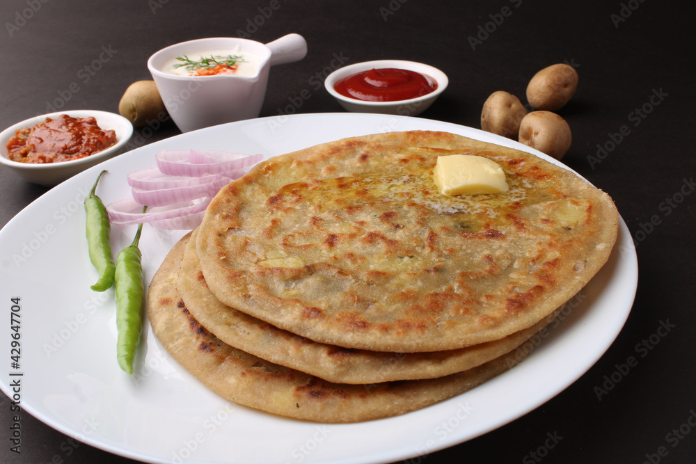 Traditional Indian food Aloo paratha or potato stuffed flat bread ...
