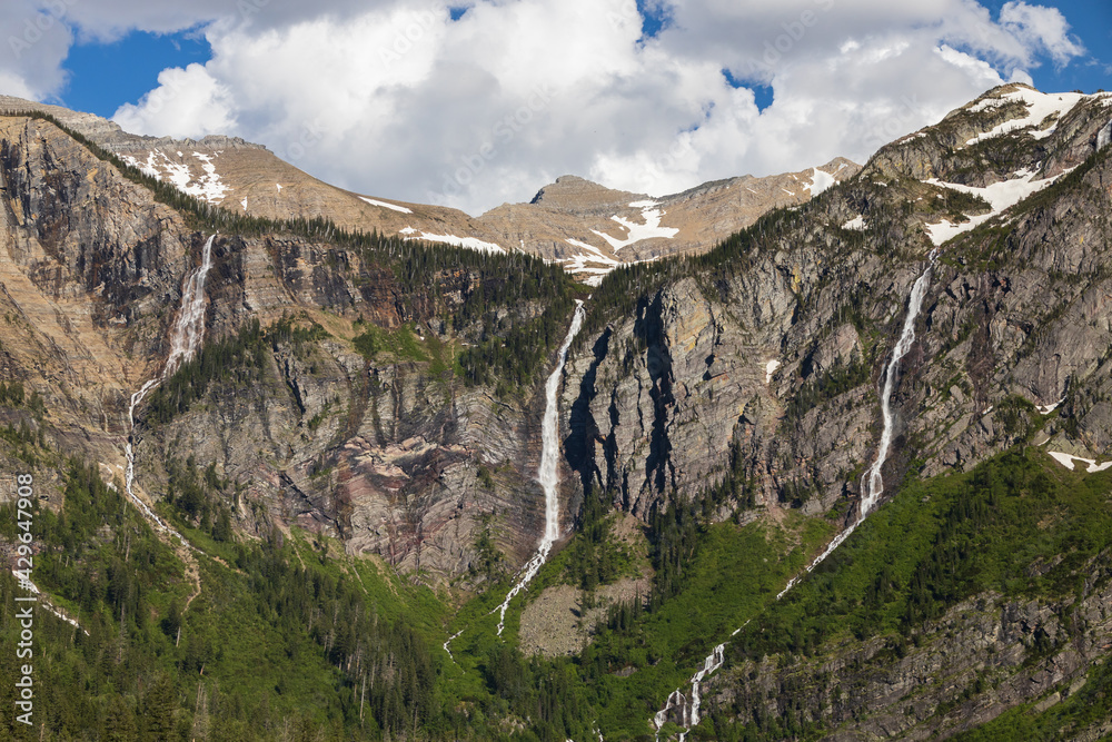 Waterfalls at Avalanche Lake and surrounding mountain range at Glacier National Park