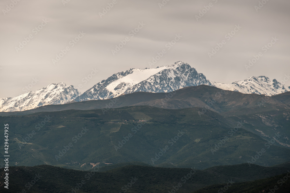 Snow capped peak of Monte Padro in Corsica