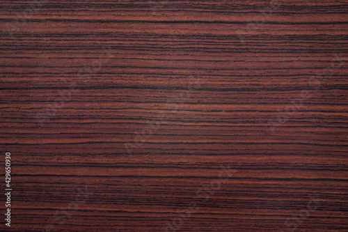 Photo of antique mahogany texture with black vertical stripes