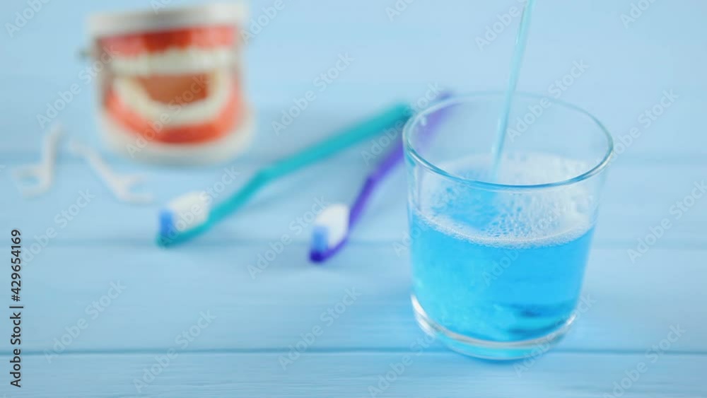 mouthwash on the table in a glass. Oral care mouthwash on the table in a glass. Oral care