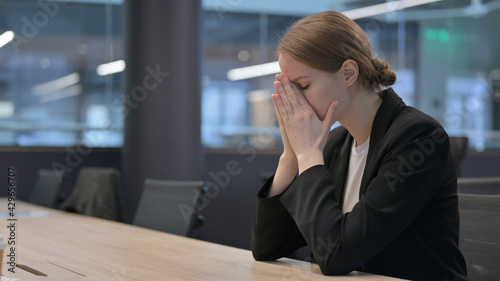 Upset Woman Feeling Angry While Sitting in Office 
