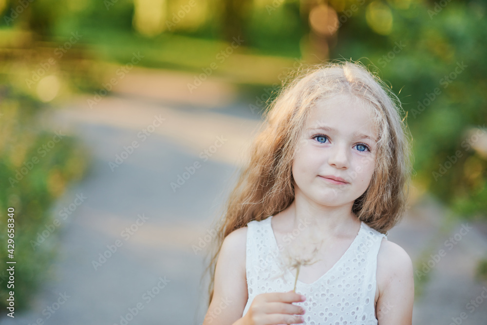 Summer portrait of girl with big dandelion. Summer portrait of girl with big dandelion.