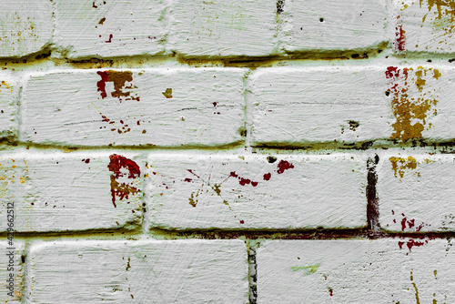 Texture of a brick wall with cracks and scratches which can be used as a background