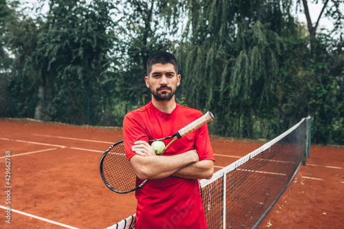 man posing on tennis court © cherryandbees