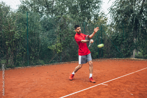 tennis player playing forehand strike on court © cherryandbees