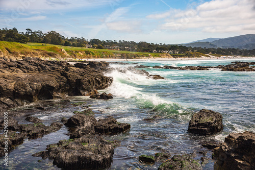 The Pacific Ocean coast in the city of Monterey in California. United States of America. Beautiful beach on a sunny day. Ocean landscape. © romeof